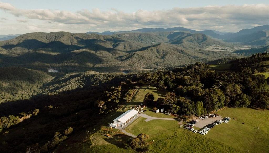Aerial view of the marquee at Rosewood Estate, La Boscosa's sister venue, against the Gold Coast hinterland ranges